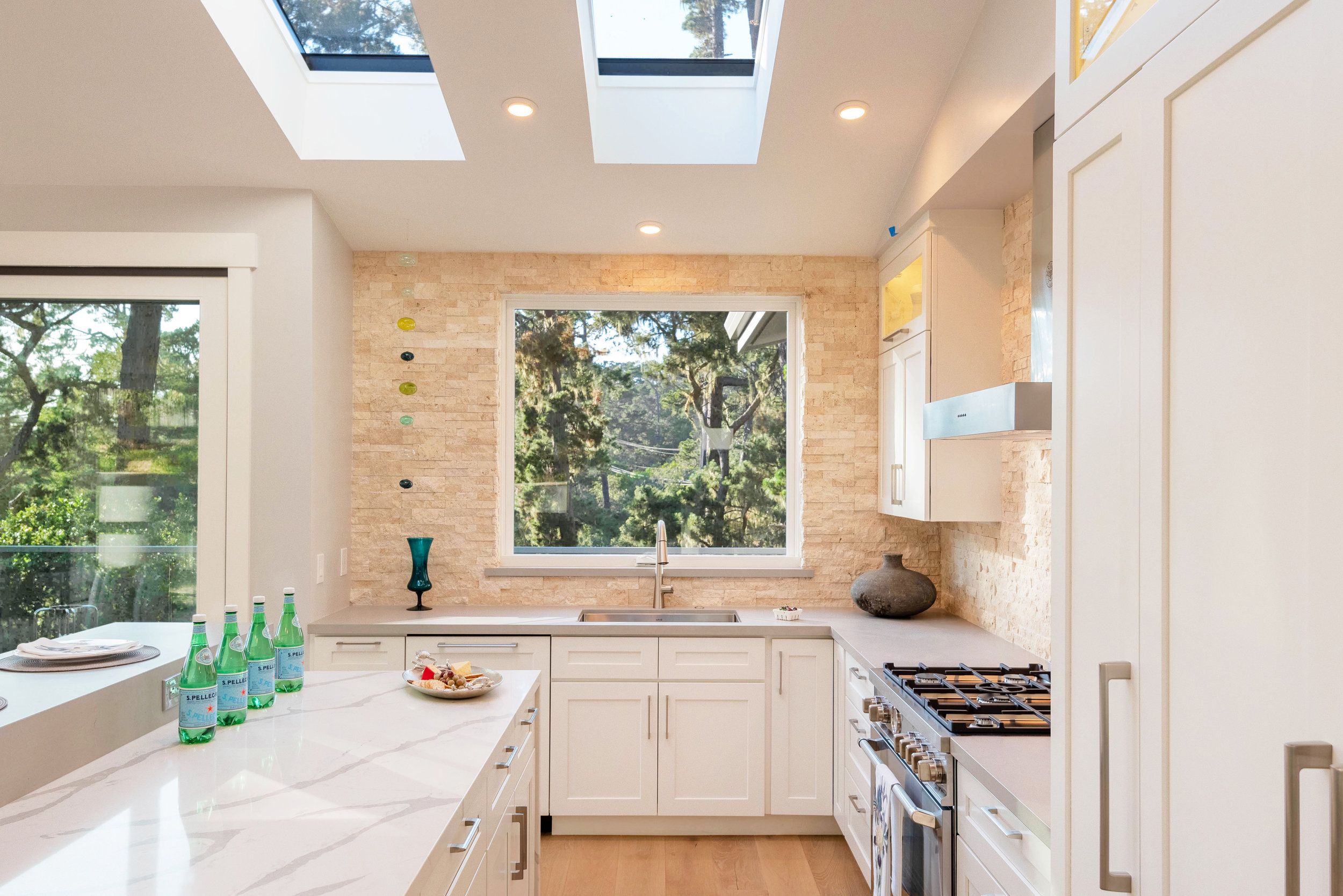 In the Kitchen: Natural light, LED lighting, wide walkways, single lever faucet, and hard surface flooring.
